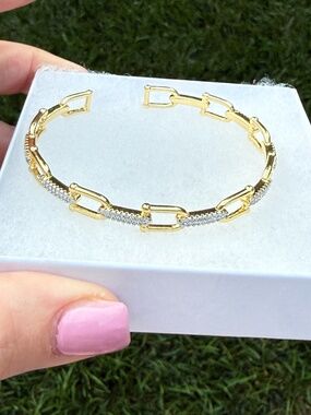Bangle bracelet with horse bit and pave links